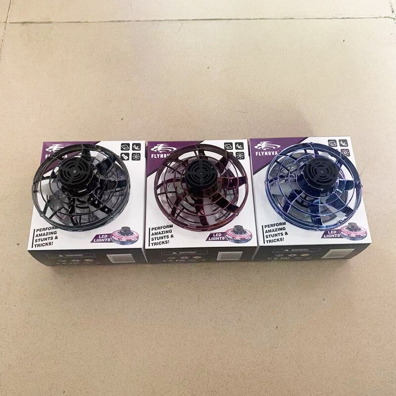 Three LED light units in a box on a cardboard surface