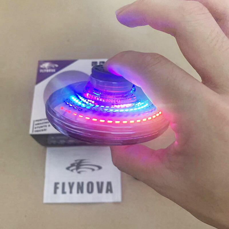 Hand holding a colorful LED spinner with FLYNOVA branding in the background.