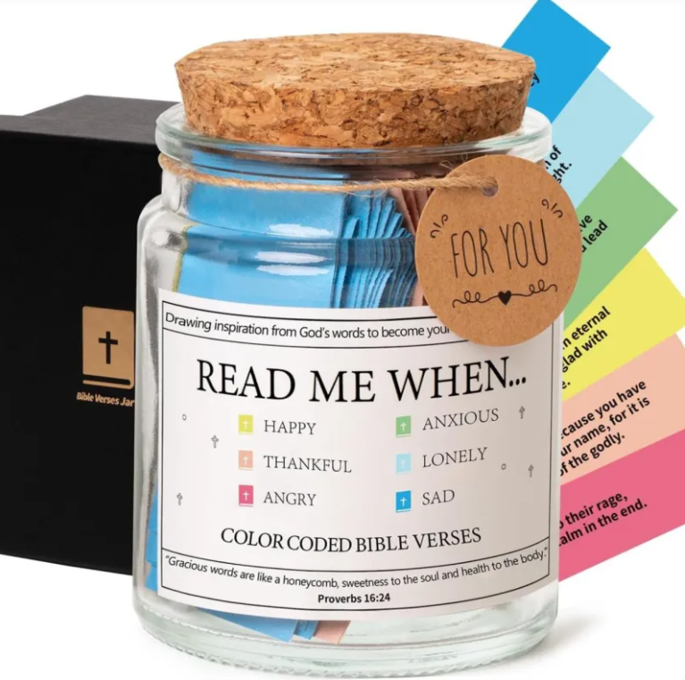 Glass jar with cork lid containing color-coded Bible verses and a tag, with colorful cards in the background.