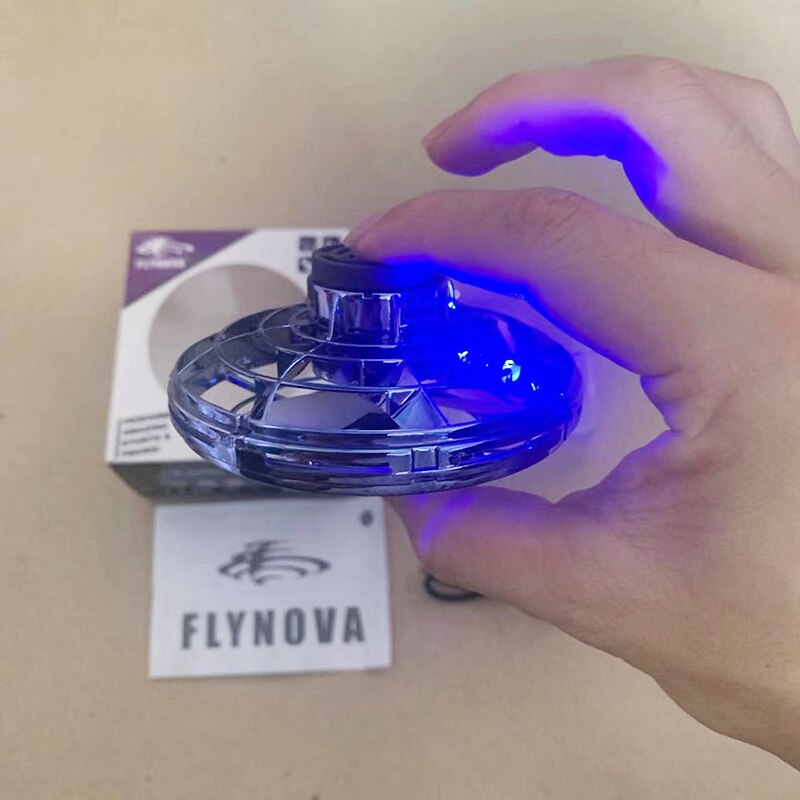 Hand holding a glowing blue device with FLYNOVA branding in the background